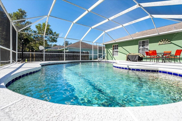 view of swimming pool with a lanai and a patio area