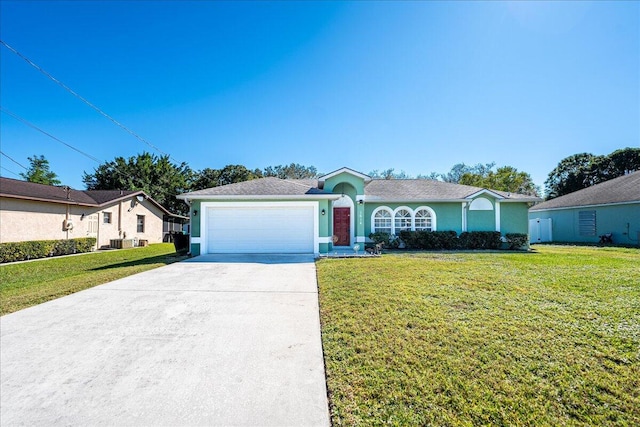 ranch-style house with a garage and a front lawn