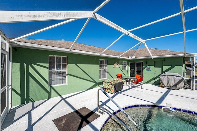 view of pool featuring a lanai and a patio