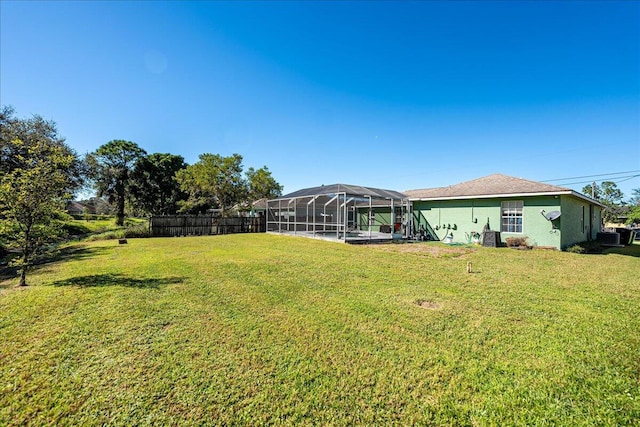 view of yard featuring a lanai and a pool