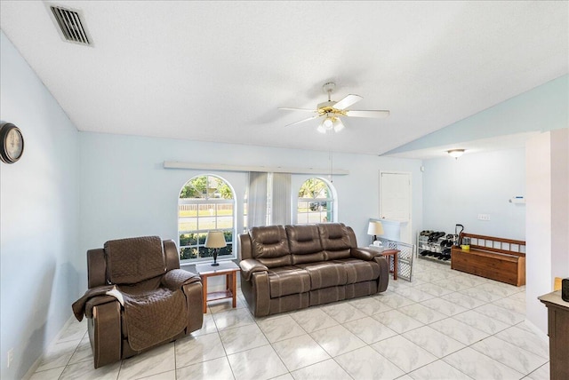 tiled living room with ceiling fan and lofted ceiling