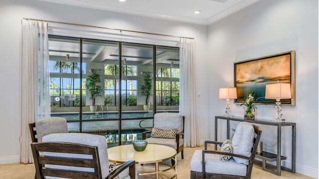 sitting room featuring ornamental molding