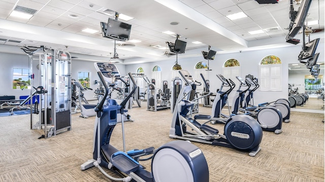 workout area with light colored carpet and a drop ceiling