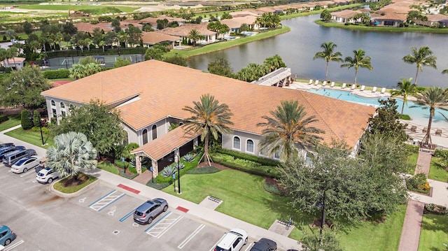 birds eye view of property with a water view