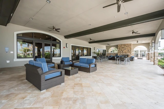 view of patio / terrace featuring ceiling fan and an outdoor living space