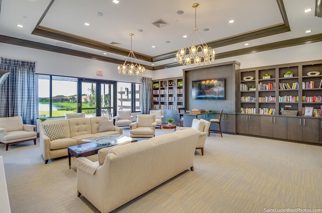 living room featuring light colored carpet and a raised ceiling