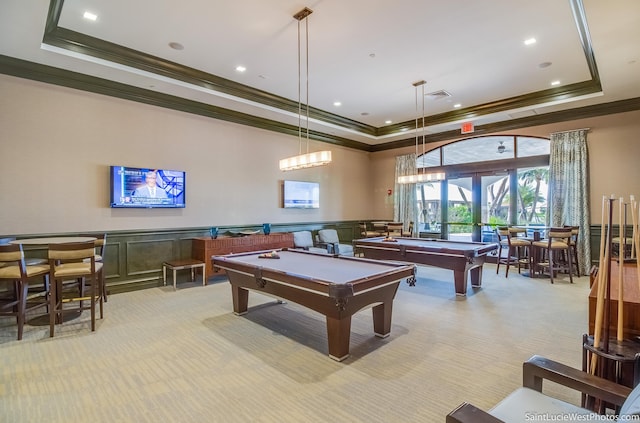 game room with ornamental molding, billiards, light carpet, and a tray ceiling