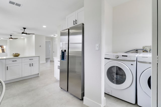 washroom featuring ceiling fan and washer and dryer