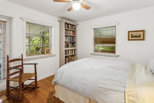 bedroom featuring dark hardwood / wood-style floors and ceiling fan