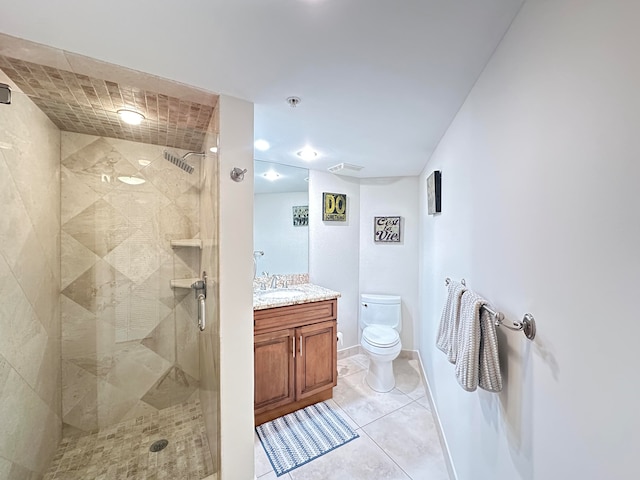 bathroom featuring tile patterned flooring, vanity, toilet, and a shower with shower door