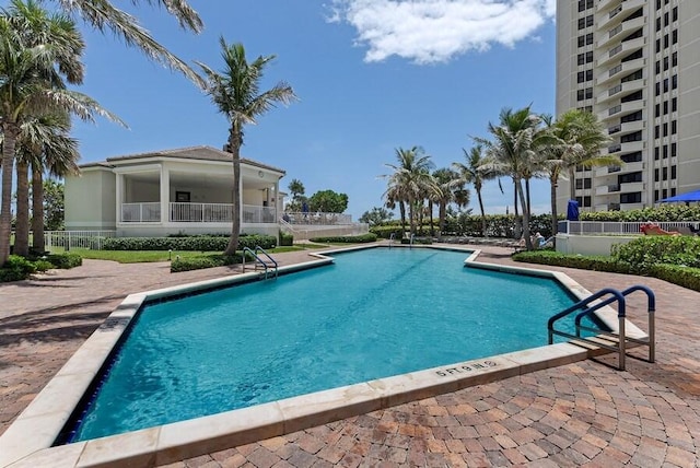 view of swimming pool with a patio