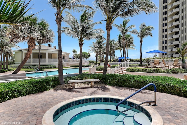 view of pool featuring a hot tub