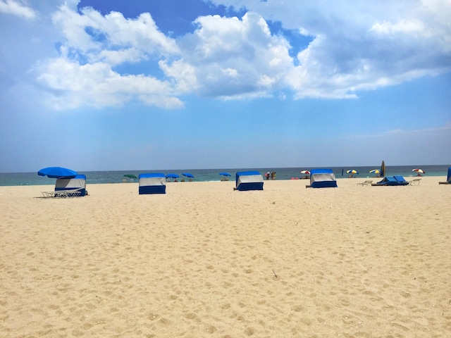 property view of water featuring a beach view