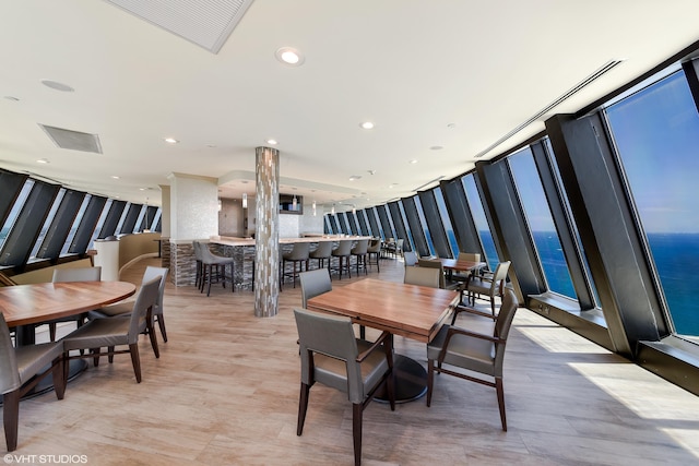 dining space featuring light wood-type flooring