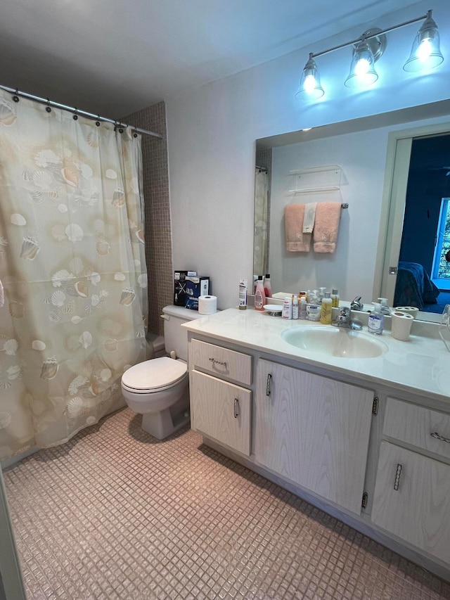 bathroom featuring walk in shower, vanity, and toilet