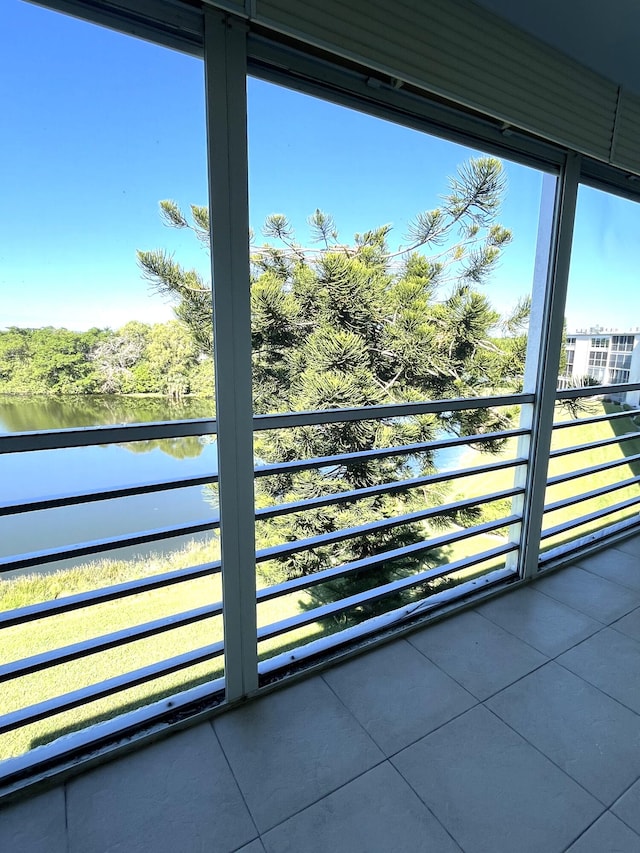 balcony featuring a water view