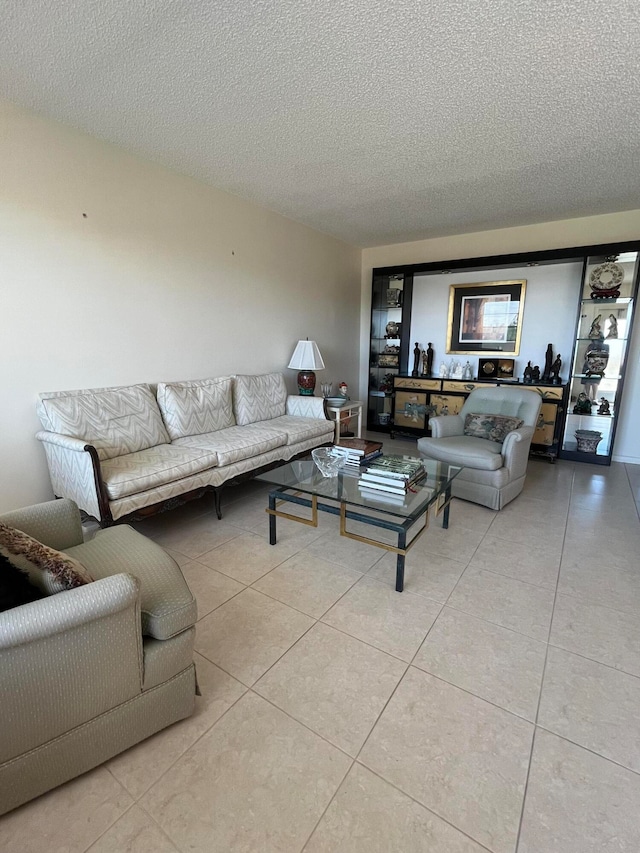 tiled living room with a textured ceiling