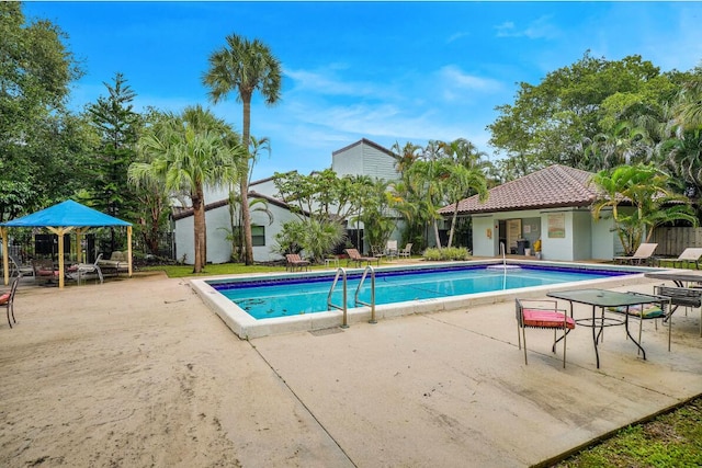 view of swimming pool with a patio