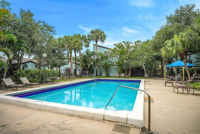 view of swimming pool featuring a patio area