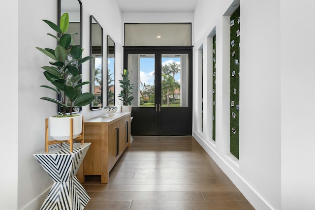 hallway with french doors and dark wood-type flooring