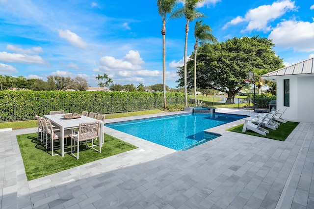 view of pool with a yard and a patio