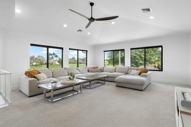 carpeted living room with vaulted ceiling and ceiling fan