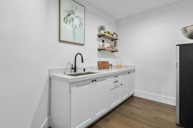 bathroom featuring vanity and hardwood / wood-style flooring