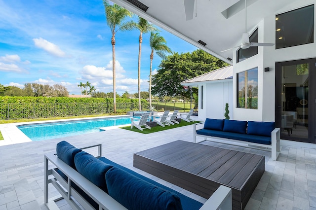 view of swimming pool with an outdoor hangout area, ceiling fan, and a patio area