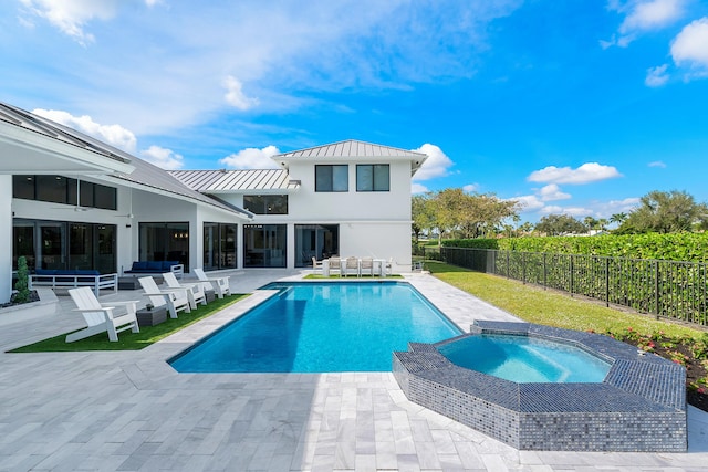 view of swimming pool featuring a patio area, an in ground hot tub, and an outdoor living space