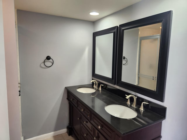 bathroom featuring tile patterned flooring and vanity