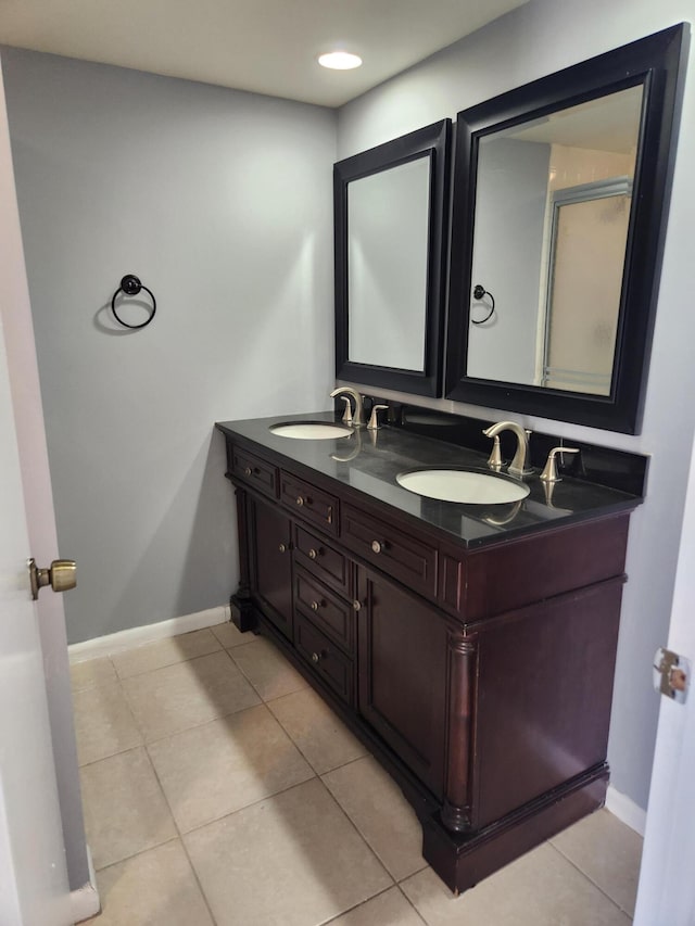 bathroom featuring tile patterned flooring and vanity