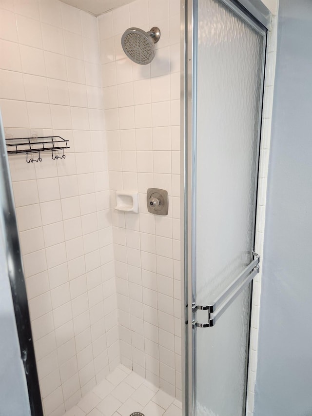 bathroom featuring an enclosed shower