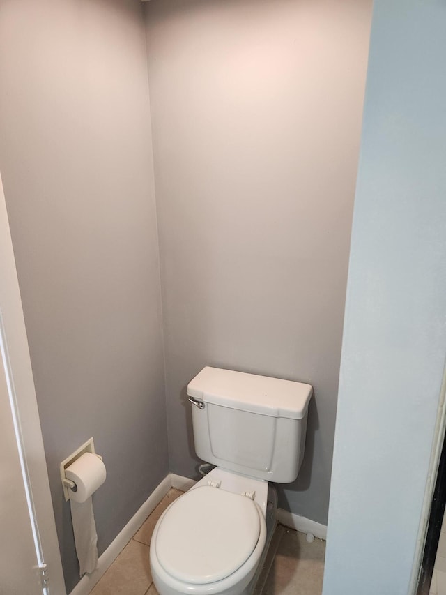 bathroom featuring tile patterned flooring and toilet