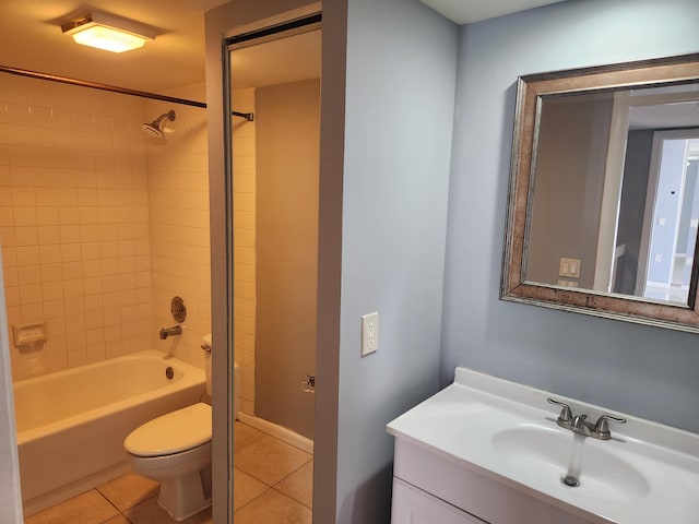 full bathroom featuring tile patterned floors, vanity, toilet, and tiled shower / bath