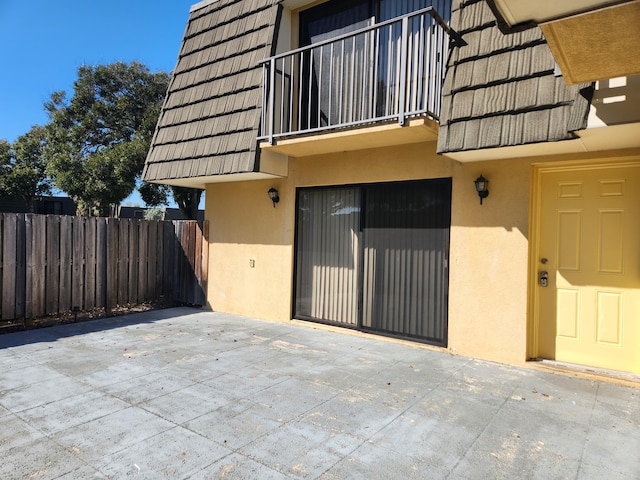 doorway to property with a patio