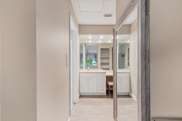 bathroom featuring vanity and wood-type flooring