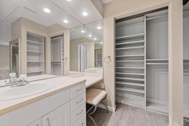 bathroom featuring vanity and wood-type flooring