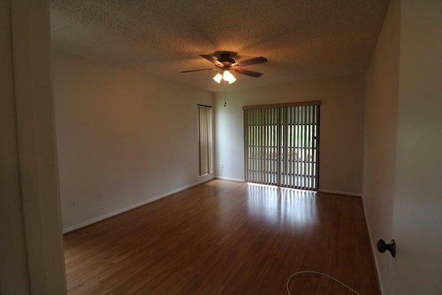 spare room with hardwood / wood-style flooring, a textured ceiling, and ceiling fan