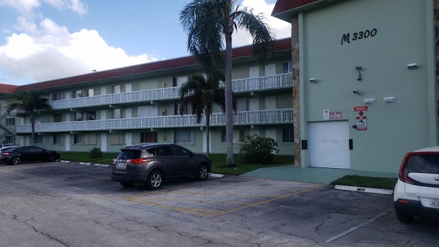 3300 Springdale Blvd, Palm Springs, FL 33461 - view of building exterior featuring uncovered parking