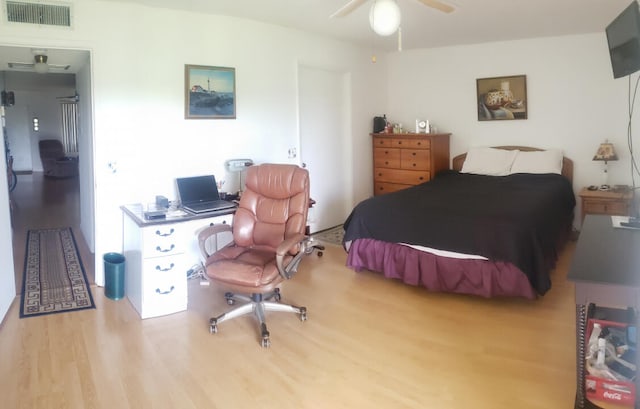 bedroom featuring ceiling fan and light hardwood / wood-style floors