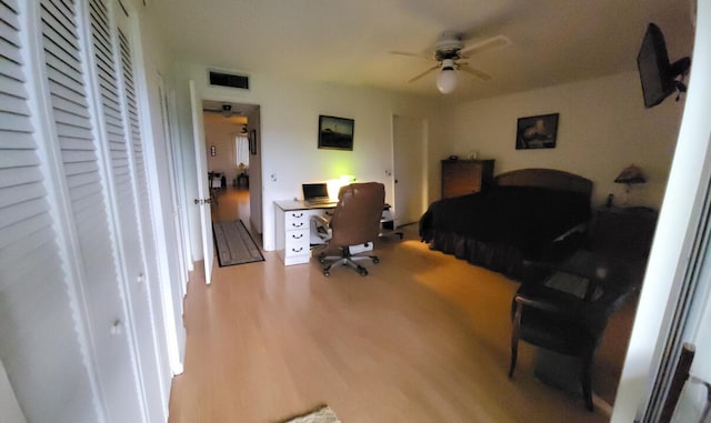 bedroom with ceiling fan and hardwood / wood-style floors