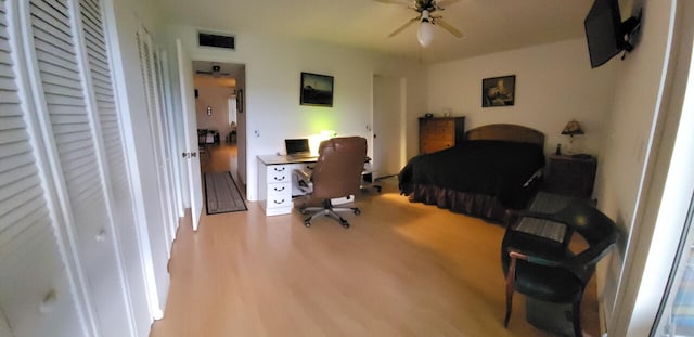 bedroom featuring light hardwood / wood-style floors and ceiling fan