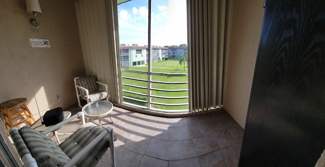 interior space featuring tile patterned flooring and plenty of natural light