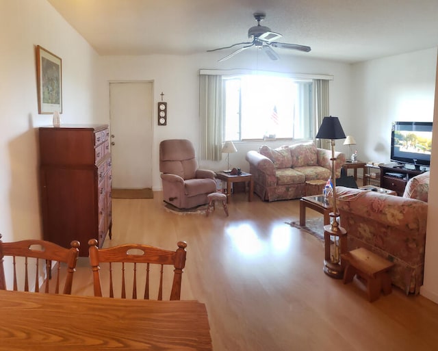 living room featuring ceiling fan and light hardwood / wood-style floors