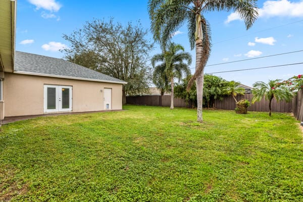 view of yard featuring french doors