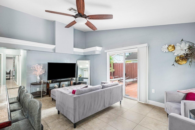 tiled living room featuring ceiling fan and lofted ceiling