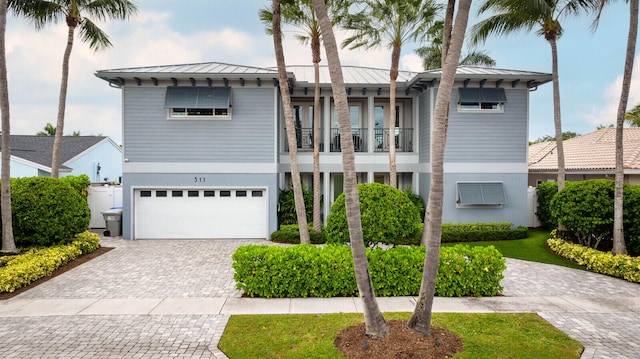 view of front of house with a balcony and a garage