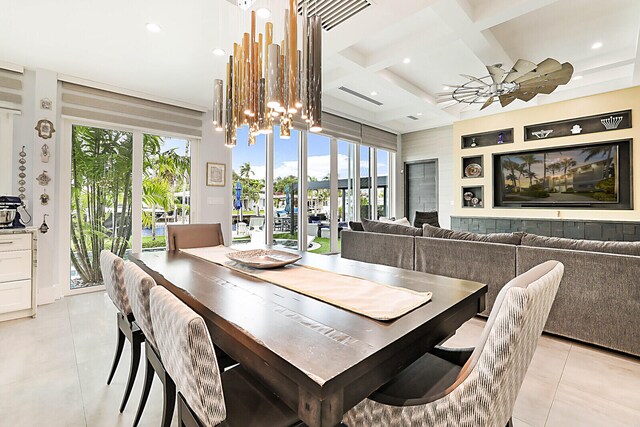 tiled dining room with beamed ceiling, ceiling fan with notable chandelier, plenty of natural light, and coffered ceiling