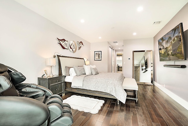 bedroom with dark wood-type flooring