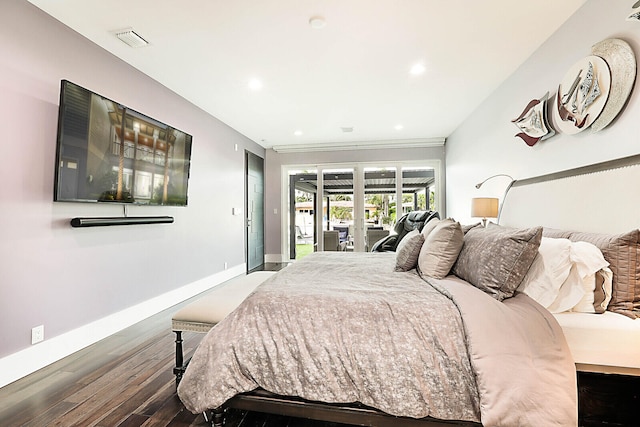 bedroom featuring hardwood / wood-style flooring and access to exterior